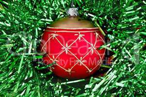 christmas red ball on the green tinsel