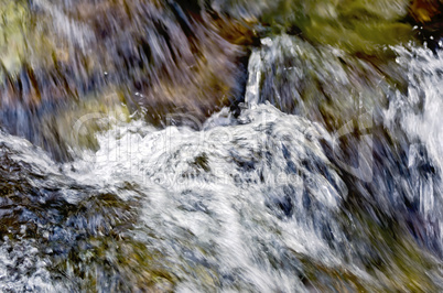 flow of the raging waterfall