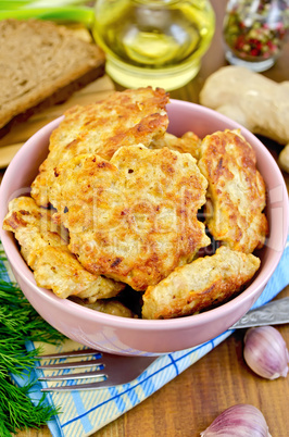 fritters chicken with bread and spices on board