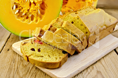 fruitcake pumpkin with candied fruits on a board