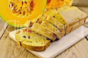 fruitcake pumpkin with candied fruits on a board