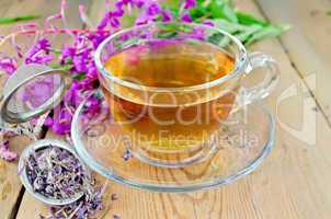 herbal tea from fireweed in a glass cup with strainer