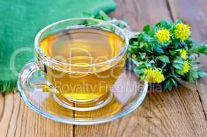 herbal tea with a bouquet of rhodiola rosea on the board