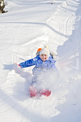little girl on a sled in the winter