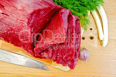 meat beef on a board with garlic