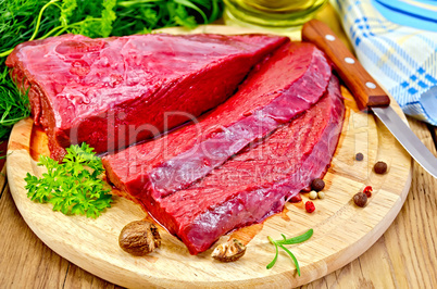 meat of a beef on the board with nutmeg