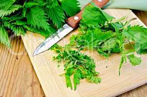 nettle on the board with a knife and napkin