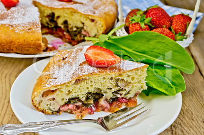 pie with strawberry and sorrel on the board