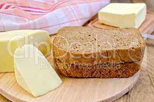 rye bread with cheese and butter on board