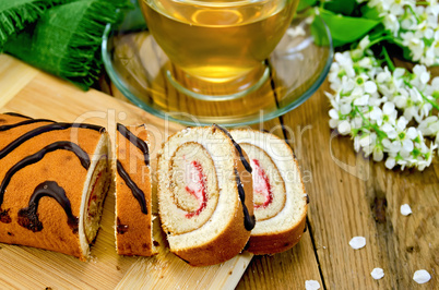 roulade with cream and jam on the board