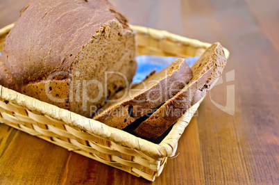 rye homemade bread in a wicker basket on the board