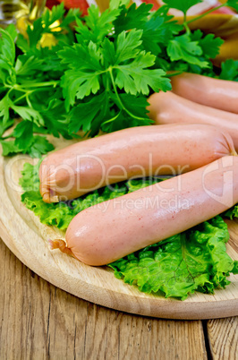 sausages on a board with parsley and oil