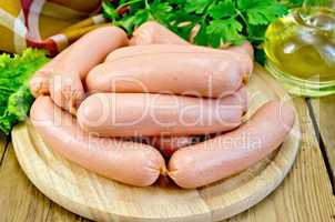 sausages on a board with parsley