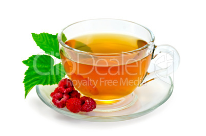 tea with raspberries in a cup