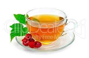 tea with raspberries in a cup
