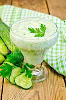 yoghurt with cucumber and parsley on the board