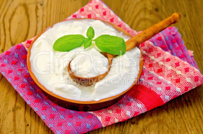 yogurt in a clay bowl with basil