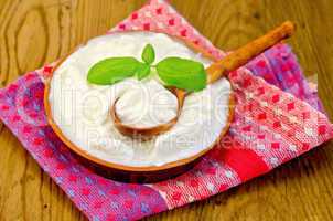 yogurt in a clay bowl with basil