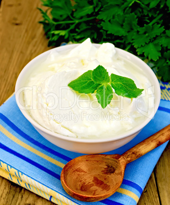 yogurt in a white bowl with mint