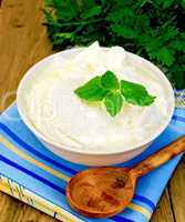yogurt in a white bowl with mint