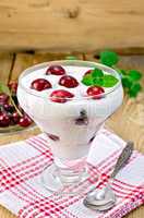 yogurt thick with cherry on the board