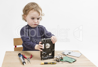 child repairing hard disk drive
