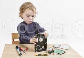 child repairing hard disk drive