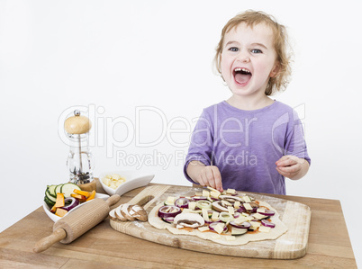 happy child making pizza
