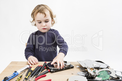 child repairing computer part