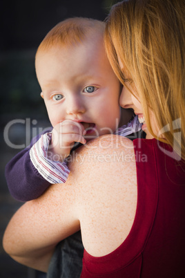 cute red head infant boy portrait with his mother