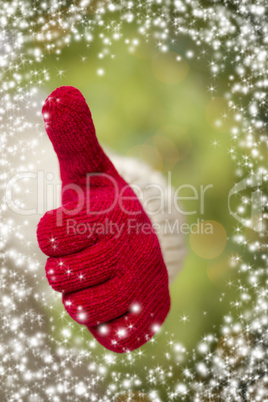 woman wearing red mittens holding out thumbs up hand sign