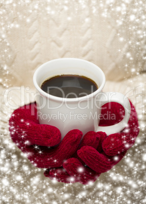 woman in sweater with red mittens holding cup of coffee