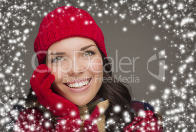 smilng woman wearing winter hat and gloves with snow effect
