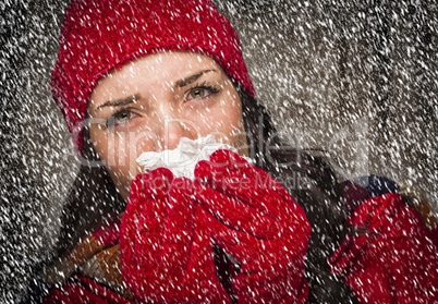 sick woman blowing her sore nose with tissue and snow
