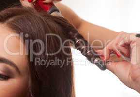 woman having her hair curled