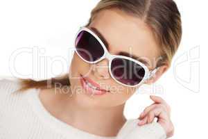 young blond woman with sunglases, studio white
