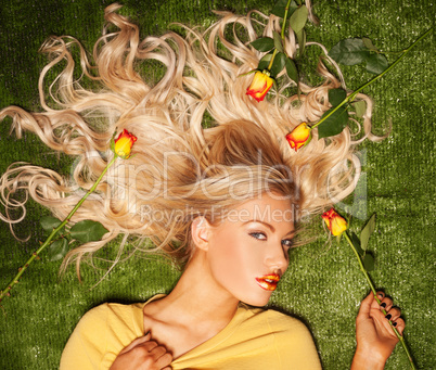 seductive blond with her hair covered in roses