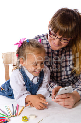 mother and daughter with mobile phone