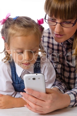 mother and daughter with mobile phone
