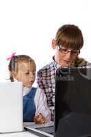 mother and daughter on the computer.