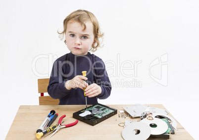 child repairing computer part