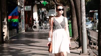 Young woman in sunglasses