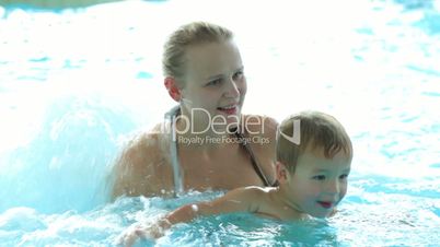 mother and her son in the swimming pool.