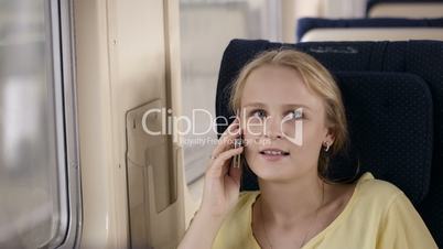 woman talking on the phone in the train.