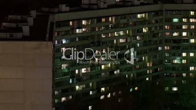 time lapse windows of building at night.