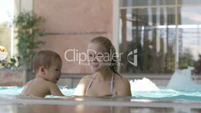 mother and her son in the swimming pool.