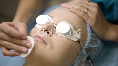 Woman being prepped in a skincare clinic