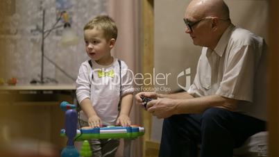 Grandfather and childred playing.