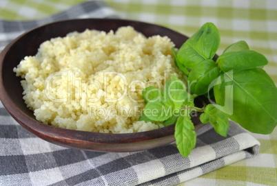 Couscous in a wooden bowl