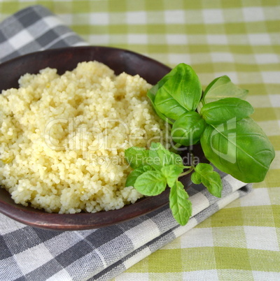 Couscous in a wooden bowl